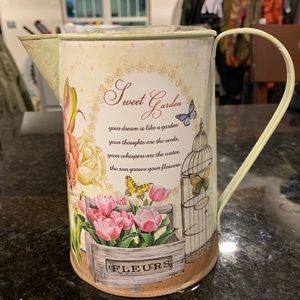 Decorative watering can.